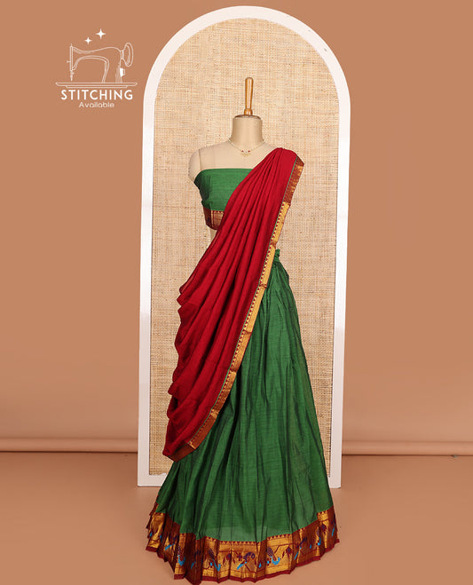 Green cotton half-saree, plain with contrast paithani style bordered skirt, matching blouse, and contrast temple border dhavani