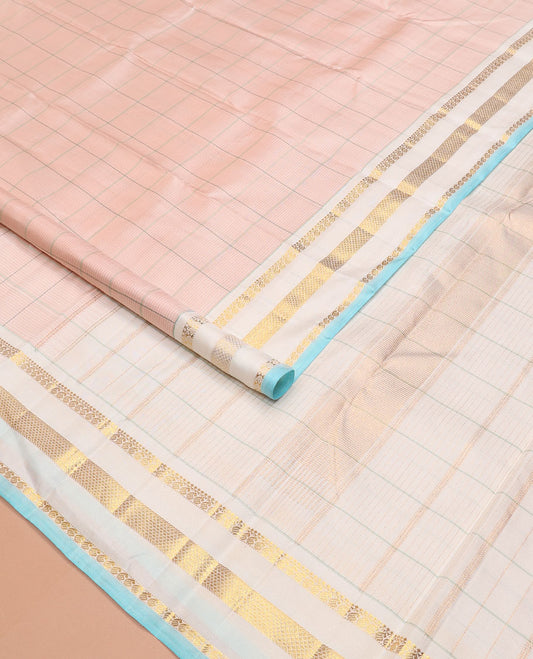 Baby pink checked Kanchipuram silk saree, contrast varisai pettu border of thilakam mokku, manga, and kuyil kann designs, and seppu rekku pallu