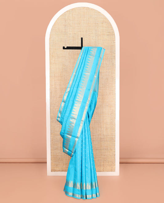 Blue Vasundhara Lite Silk Mix Saree, Subtly Sparkled with Zari Buttas All Over Its Body, Highlighted by a Zari Rettai Pettu Border of Thazampoo Rekku, Salngai, Yaanai and Mayil Designs, Gleaming Jaal Pallu, and Paired with a Matching Blouse