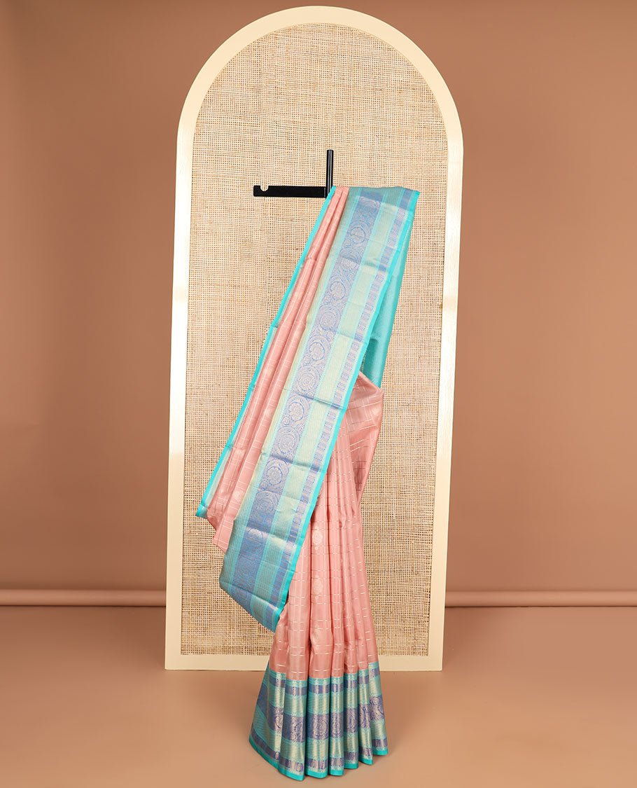 Peach floral buttas silk saree with contrast floral zari design border & geometric design pallu