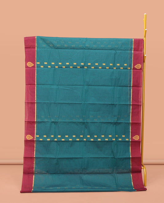 Blue Kanchi Cotton Saree, Accentuated with Buttas, Contrast Unique Motifs Woven Border, Pallu of Jaal Design, and a Matching Blouse