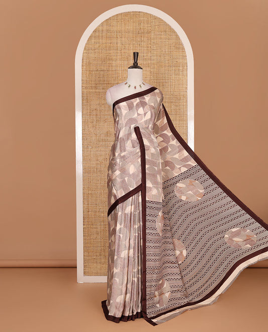 Beige geometric patterns printed Turkey crepe saree, contrast printed piping border, printed pallu, and printed blouse
