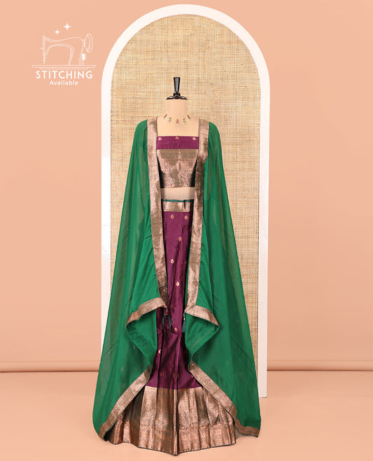 Dark Magenta-Green Semi-Banarasi Half-Saree Features Buttas Skirt,Contrast Traditional Zari Border, a Matching Blouse, and a Contrast Satin Georgette Dhavani