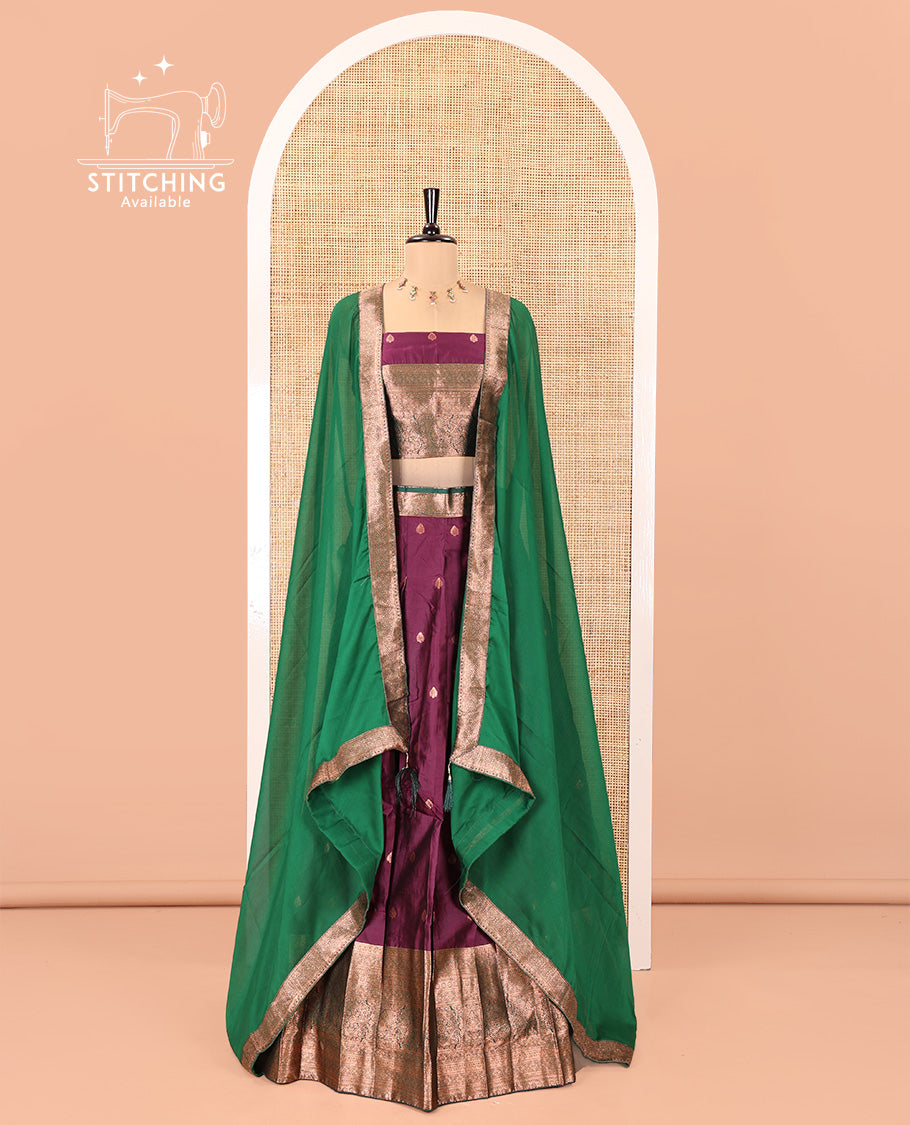 Dark Magenta-Green Semi-Banarasi Half-Saree Features Buttas Skirt,Contrast Traditional Zari Border, a Matching Blouse, and a Contrast Satin Georgette Dhavani
