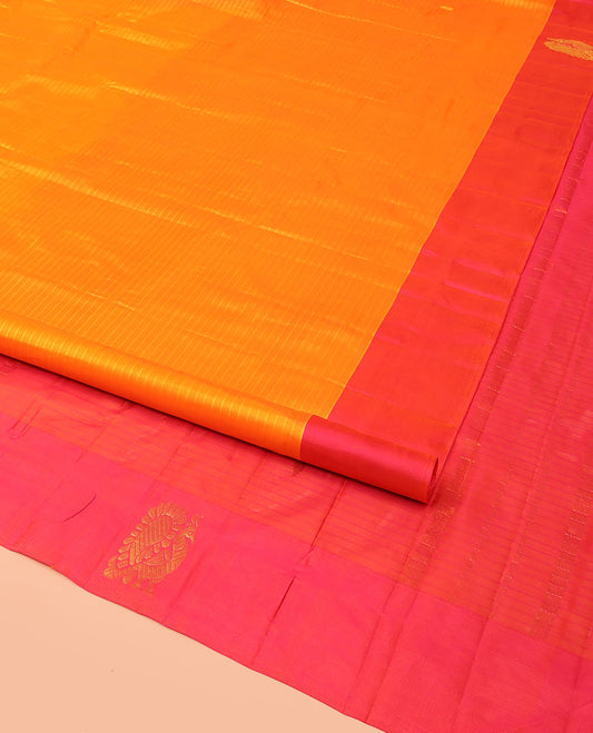 Orange Kanchipuram Silk Saree Simply Sparkled with Vazhaipoo Stripes and Zari Buttas, Complemented by Contrast Border of Mayil Designs, Contrast Pallu of Zari Buttas, and Paired with a Contrast Blouse