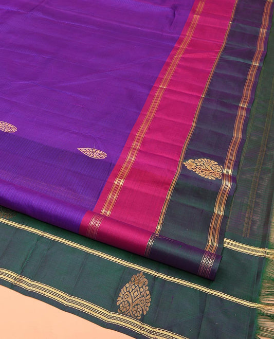 Purple Kanchipuram Silk Saree, Mesmerized with Buttas and Vazhaipoo Stripes All Over Its Body, Complemented by a Contrast Border of Muthu, Kathir, and Arumbu Manga Designs, Sparsely Woven Pallu, and Paired with a Contrast Blouse