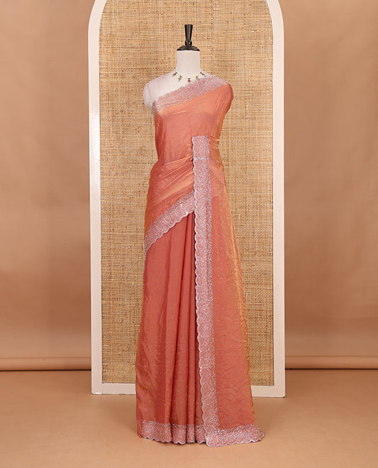 Onion Pink Swarovski crystal stone embedded fendy chiffon saree, scallop Swarovski stone embroidered border, and contrast plain blouse