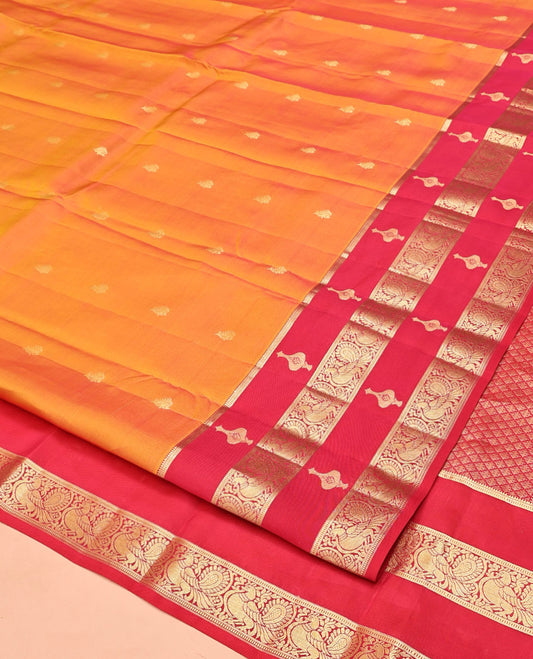 Orange Vasundhara Silk Mix Saree, Richly Woven with Zari Buttas All Over Its Body, Complemented by Contrast Border of Peacock Designs, Grand Jaal Pallu, and Paired with a Contrast Blouse