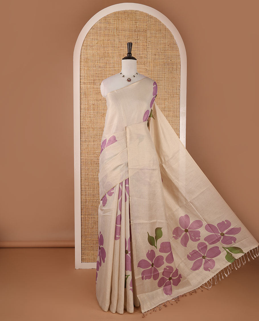 Borderless cream printed onam tissue silk saree features light lavender color five-petal flower & leaf motifs print, matching floral print blouse