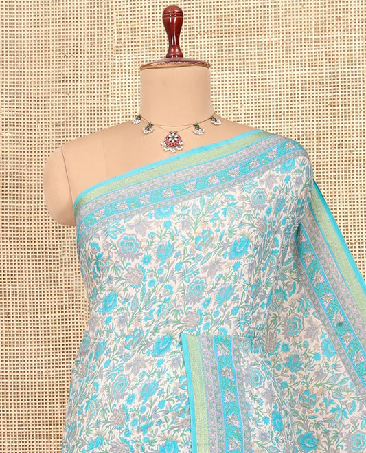 Off White Printed Silk Saree, Spotlighted with Floral-Vine Print, a Contrast Traditional Zari Border, Floral Pallu, and a Contrast Blouse
