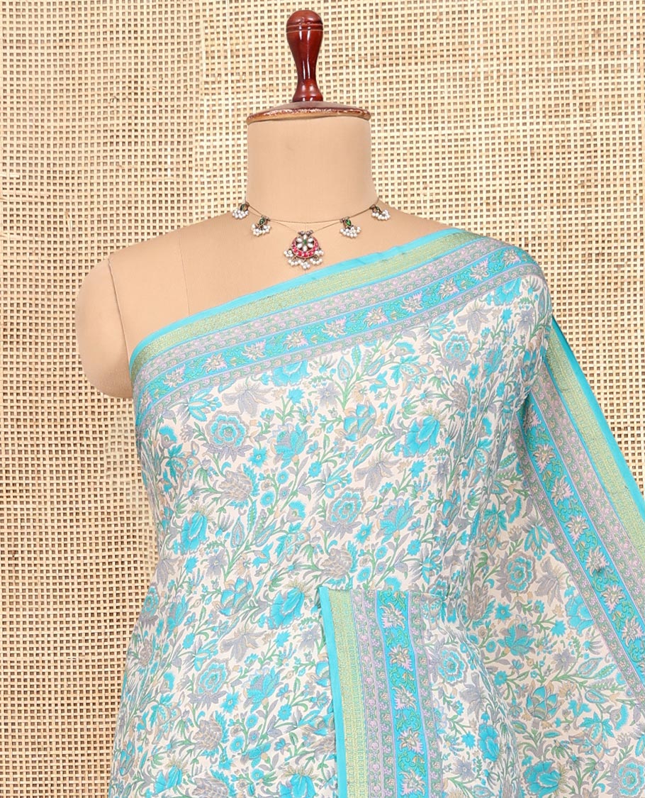 Off White Printed Silk Saree, Spotlighted with Floral-Vine Print, a Contrast Traditional Zari Border, Floral Pallu, and a Contrast Blouse
