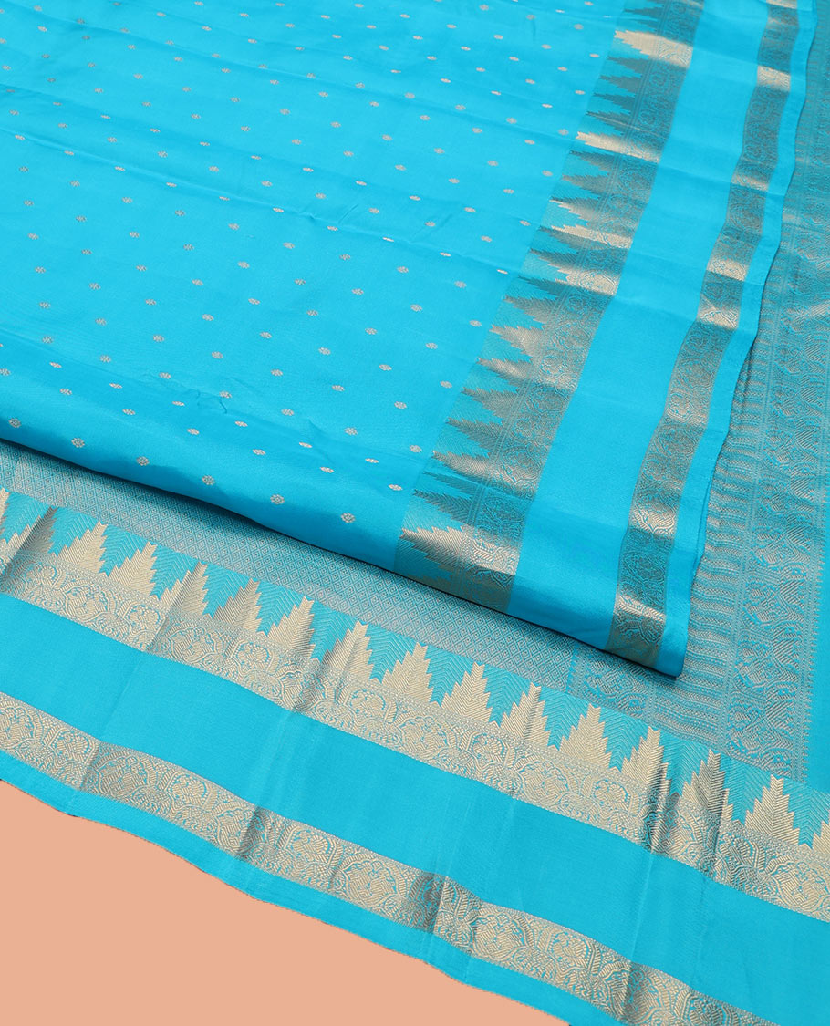 Blue Vasundhara Lite Silk Mix Saree, Subtly Sparkled with Zari Buttas All Over Its Body, Highlighted by a Zari Rettai Pettu Border of Thazampoo Rekku, Salngai, Yaanai and Mayil Designs, Gleaming Jaal Pallu, and Paired with a Matching Blouse