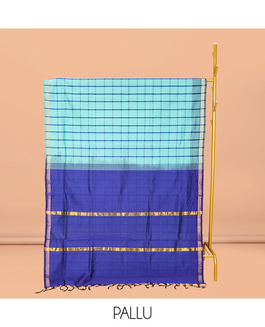 Blue Checked Poly Cotton Saree, Highlighted by a Self-Border, Contrast Zari Striped Pallu, and Paired with a Contrast Blouse