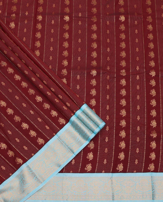 Maroon Art Silk Pavadai Material Set, Prettified with Buttas and Stripes on Its Skirt, Complemented by a Contrast Traditional Zari Design Border, and Paired with a Contrast Blouse