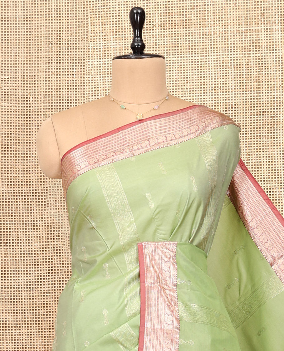 Elaichi Green Budget Silk Saree, Subtly Sparkled with Zari Buttas, Complemented by Contrast Traditional Zari Border, Grand Pallu, and Contrast Blouse
