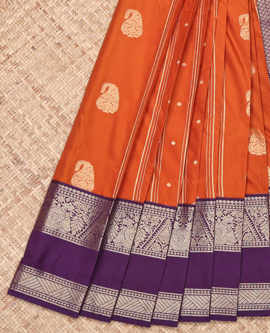 Rust Budget Silk Saree, Elevated with Zari Buttas and Stripes on Its Body, Complemented by a Contrast Traditional Zari Border of Gandaberunda Designs, Jaal Pallu, and Paired with a Contrast Blouse