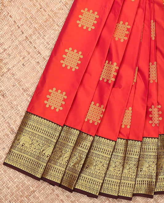 Orange Budget Silk Saree Features Kolam Buttas, Complemented by a Contrast Traditional Zari Border, Grand Pallu, and a Contrast Blouse