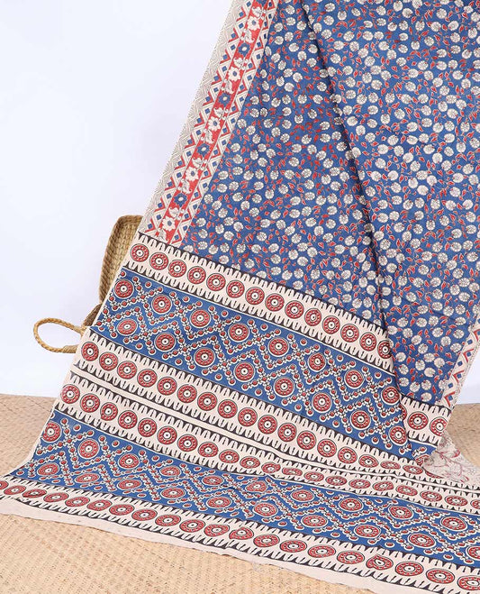 Blue floral vine machine-printed kalamkari cotton saree, contrast geometric border & intricate motifs pallu