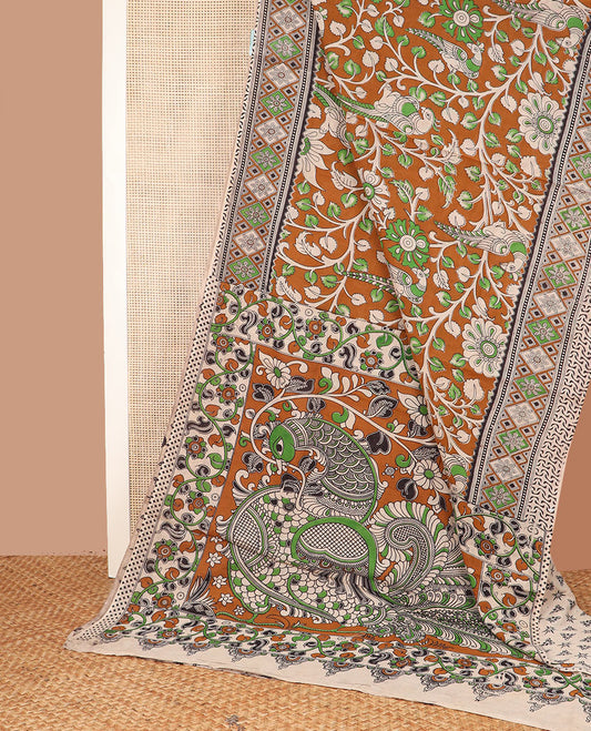 Mustard floral vine and peacock machine-printed Kalamkari cotton saree, contrast geometric border, and pallu of kalamkari peacock