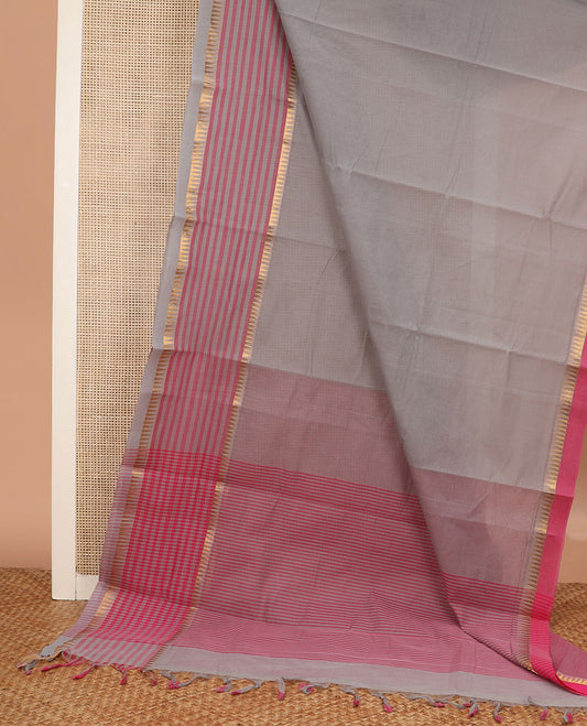 Grey striped chirala cotton saree, temple border of stripes, striped pallu, and contrast floral vine and bird printed blouse