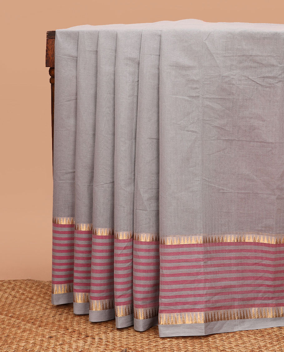 Grey striped chirala cotton saree, temple border of stripes, striped pallu, and contrast floral vine and bird printed blouse