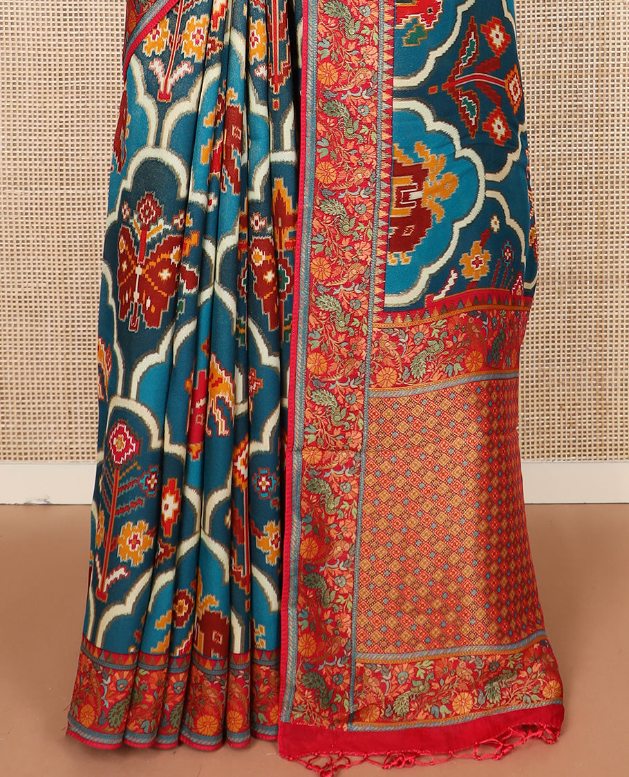 Blue ikkat design printed dola silk saree, contrast floral vine, and peacock border, and jaal pallu