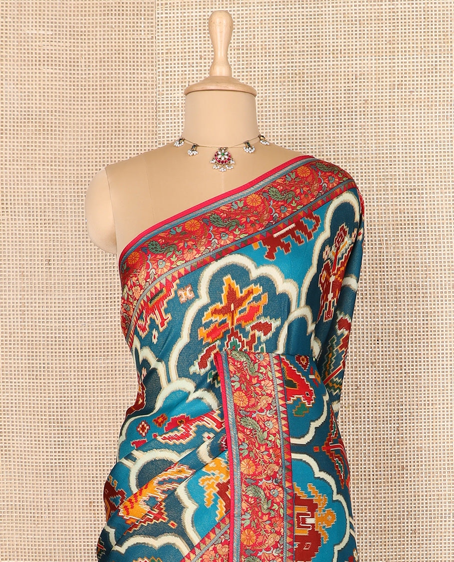 Blue ikkat design printed dola silk saree, contrast floral vine, and peacock border, and jaal pallu