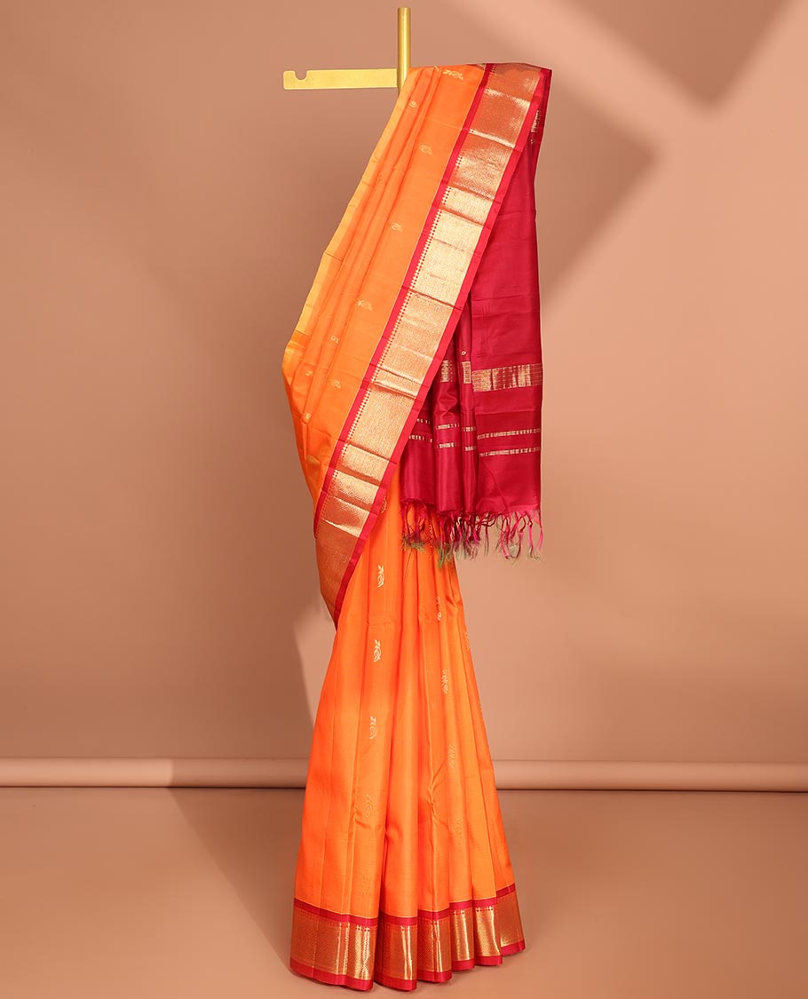 Orange  floral buttas kancheepuram silk saree with contrast border of sombu,banaras, jaal design & zari design pallu