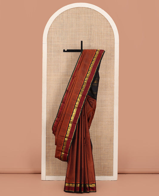 Rust Vazhaipoo Striped Kanchipuram Silk Saree, Complemented by a Contrast Rettai Pettu Border Featuring Yaanai, and Kathir Designs, Sparsely Zari Woven Pallu, and Paired with a Contrast Blouse