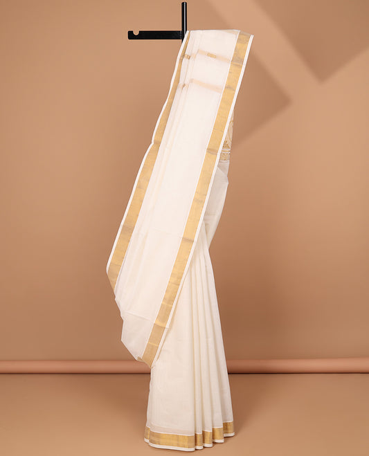 Cream kerala saree with zari stripes, zari border & pallu of peacock zari designs