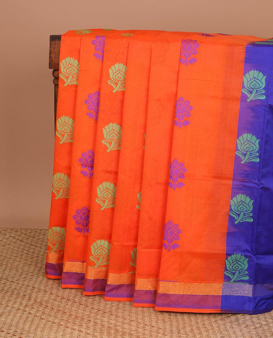 Orange kuppadam cotton saree with floral buttas, contrast border & pallu of floral & peacock designs