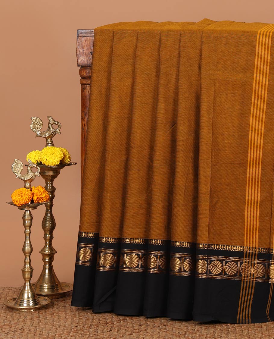 Mustard yellow plain Chettinad cotton saree, contrast zari traditional border of thilakam mokku & rudraksham design & striped pallu