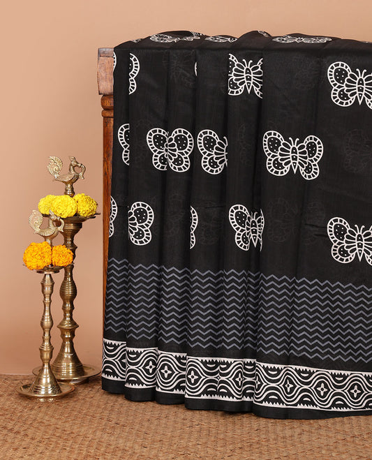 Black butterfly motifs handblock printed jute cotton saree, self-border & pallu of blockprinted geometric patterns & plain black blouse