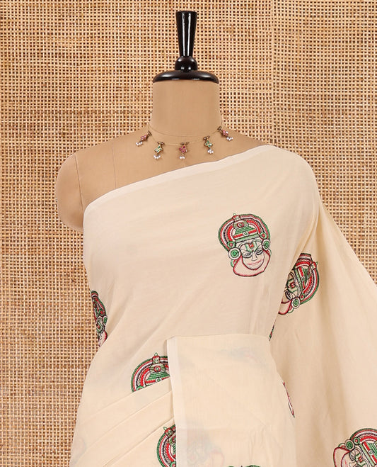 Borderless cream kathakali motifs embroidered South cotton saree, kathakali motifs embroidered pallu, and a matching plain blouse