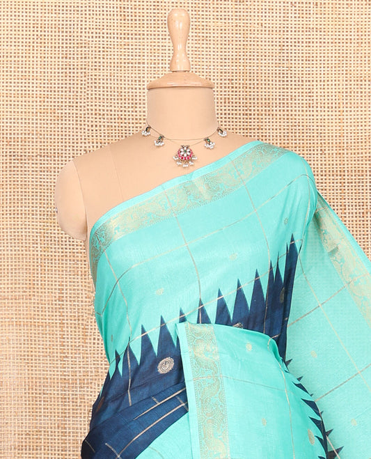 Blue and rama zari butta enclosed checked dola silk saree, contrast temple traditional motifs border, paisley motifs printed pallu, and a contrast butta enclosed checked blouse