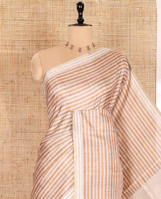 Yellow  Semi-Tussar Saree Featuring Horizontal Stripe Prints, Accentuated by a Subtle Resham Thread Temple-Designed Border, with a Pallu Highlighted by Intricate Circular Motifs, Paired with a Contrast Bandhani Blouse