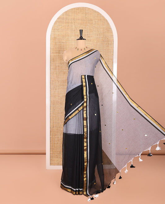 Grey and Black Khadi Mul Cotton Saree, Beautifully Bedecked with Double-Color Half-And-Half-Style Jamki Work, Complemented by Contrast Zari Border, and Paired with a Matching Blouse