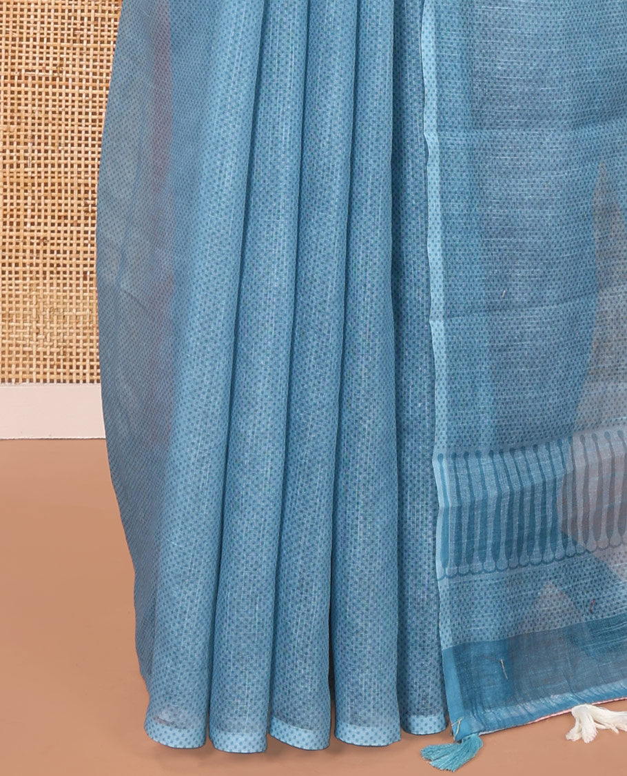 Borderless Cream and Blue Linen Cotton Saree, Accentuated with Half-and-Half Style Fish Motifs Printed All Over Its Body, Pallu Mirrors the Same Print, and Is Paired with a Contrast Blouse