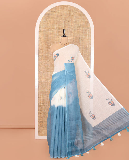Borderless Cream and Blue Linen Cotton Saree, Accentuated with Half-and-Half Style Fish Motifs Printed All Over Its Body, Pallu Mirrors the Same Print, and Is Paired with a Contrast Blouse