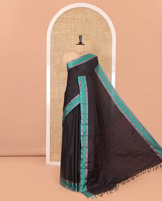 Black Soft Silk Saree, Subtly Sparkled with Stripes All Over Its Body, Complemented by a Contrast Zari Striped Border, Pallu of Stripes, and Paired with a Matching Blouse