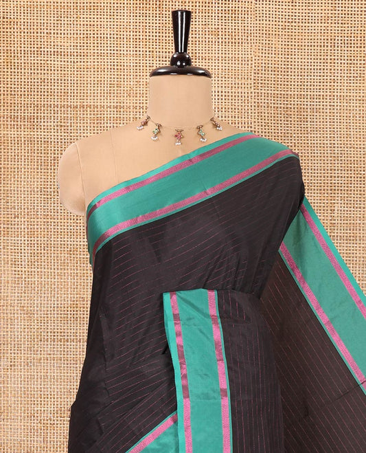 Black Soft Silk Saree, Subtly Sparkled with Stripes All Over Its Body, Complemented by a Contrast Zari Striped Border, Pallu of Stripes, and Paired with a Matching Blouse
