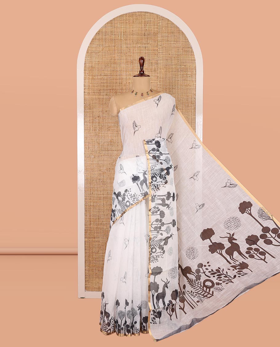 White Linen Cotton Saree, Accentuated with Flora-Fauna Print, a Piping Border, Printed Pallu and a Contrast Blouse