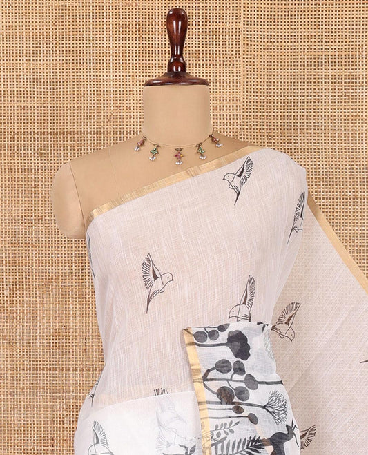 White Linen Cotton Saree, Accentuated with Flora-Fauna Print, a Piping Border, Printed Pallu and a Contrast Blouse