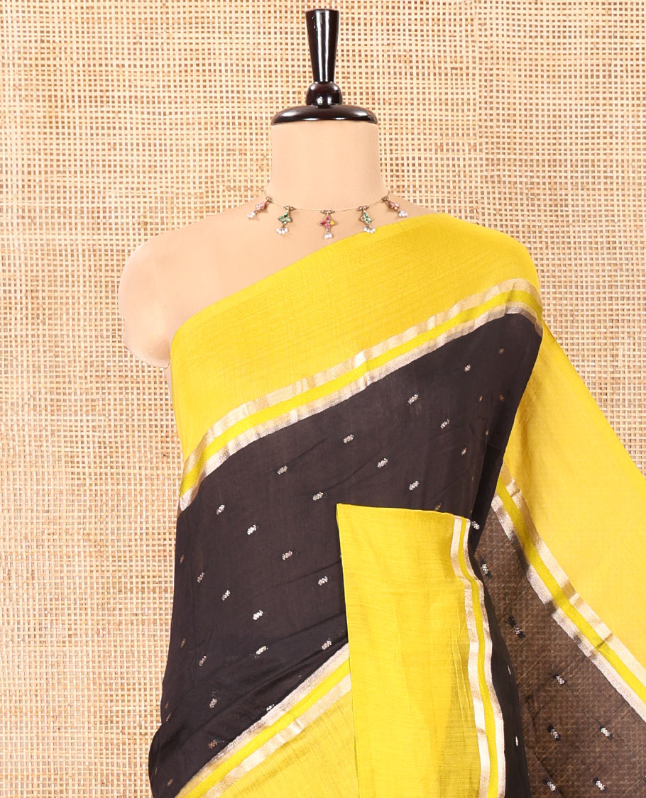 Black Assam Silk Saree, Ornamented with Zari Buttas on Its Body, Complemented by Contrast Zari Striped Border, Pallu Steeped with Gleaming Zari Stripes and Buttas, and Paired with a Contrast Blouse
