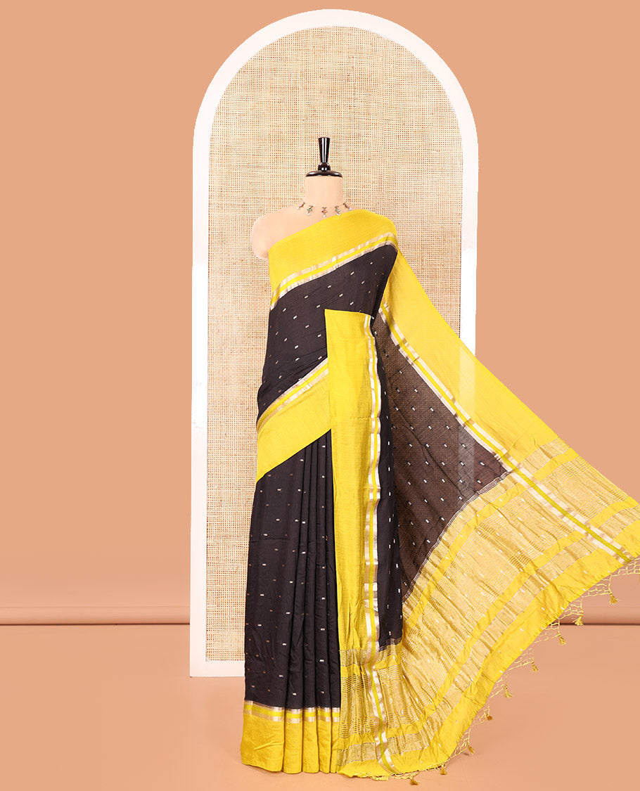 Black Assam Silk Saree, Ornamented with Zari Buttas on Its Body, Complemented by Contrast Zari Striped Border, Pallu Steeped with Gleaming Zari Stripes and Buttas, and Paired with a Contrast Blouse