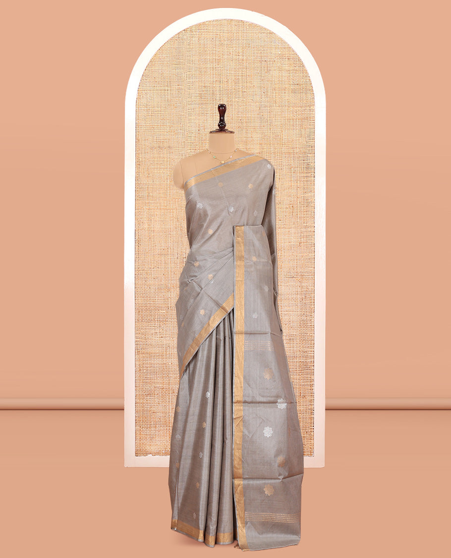 Grey Tussar Saree Subtly Sparkled with Buttas, a Subtle Zari Border, Pallu of Zari Designs, and a Matching Blouse