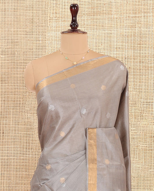 Grey Tussar Saree Subtly Sparkled with Buttas, a Subtle Zari Border, Pallu of Zari Designs, and a Matching Blouse