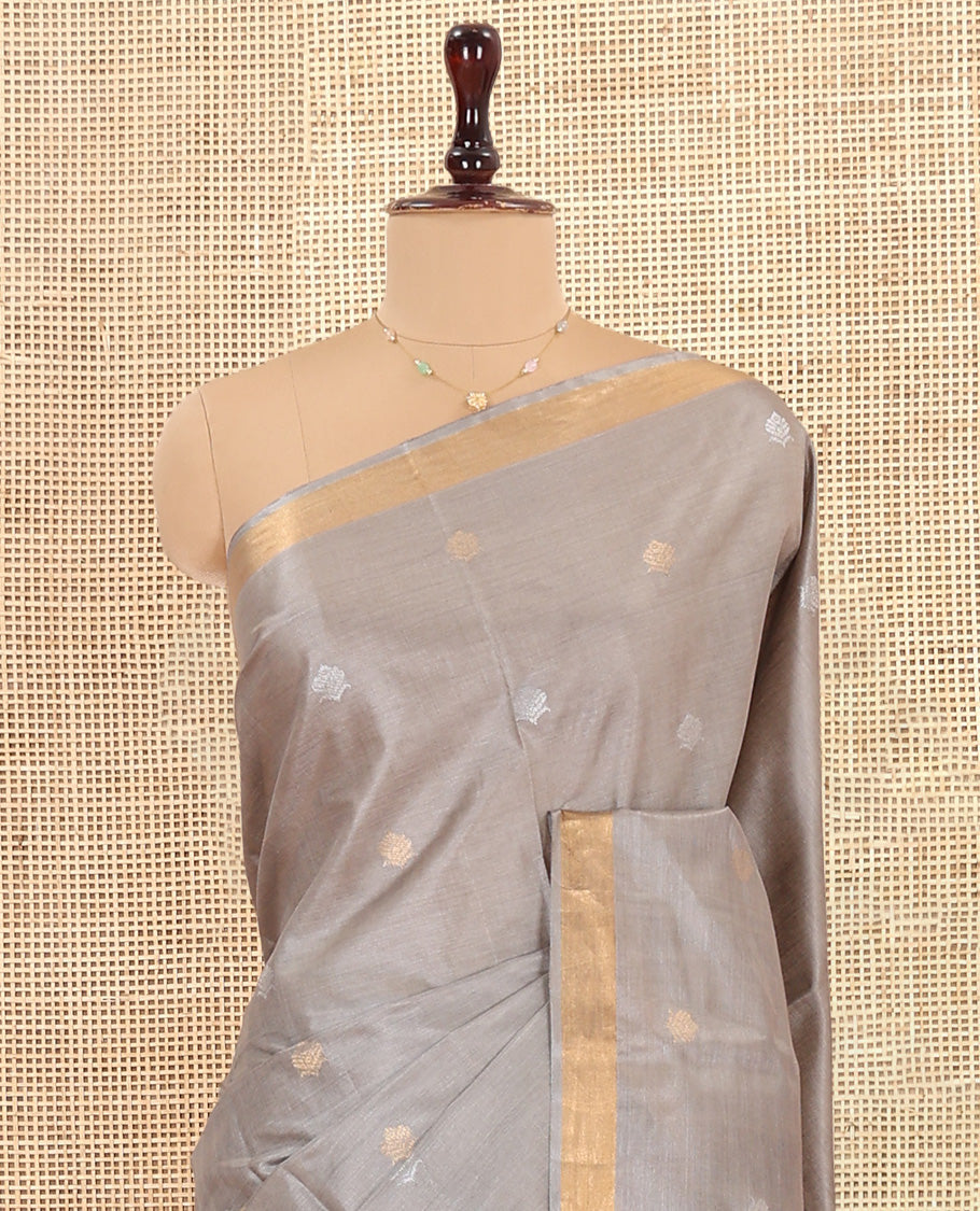 Grey Tussar Saree Subtly Sparkled with Buttas, a Subtle Zari Border, Pallu of Zari Designs, and a Matching Blouse