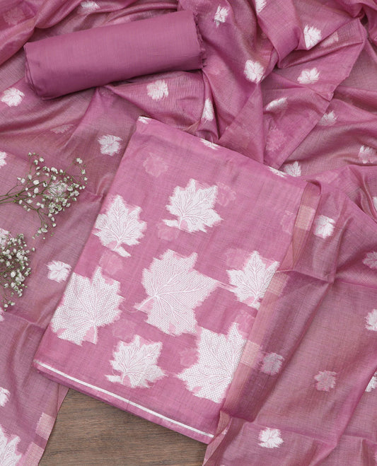Onion pink material churidar set, leaf motifs top, plain bottom, and a dupatta steeped with leaf motifs