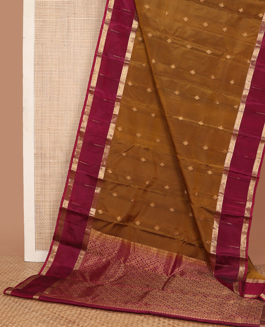 Mustard vasundhara elite silk saree with zari buttas, contrast border of manga,kathir,muthu & kodi visiry & pallu of chakra butta enclosed jaal